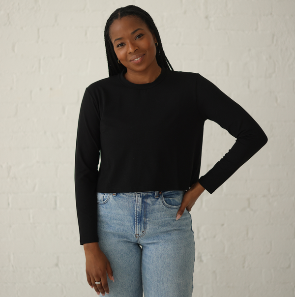 Black girl wearing black long sleeve crop top tshirt